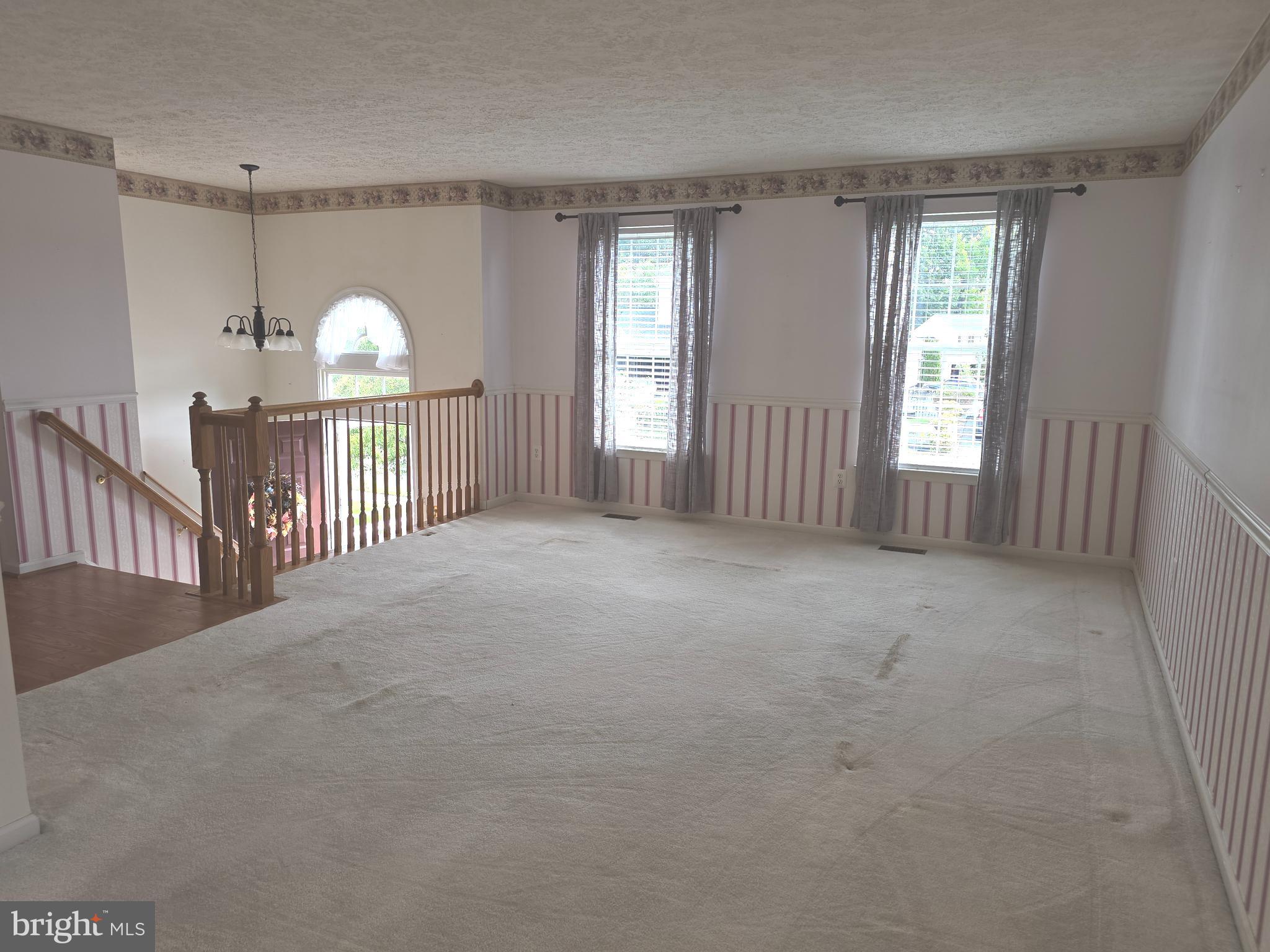 702 Jonathan Drive Joppa, MD 21085 - Photo 15 of 34 a view of empty room with windows