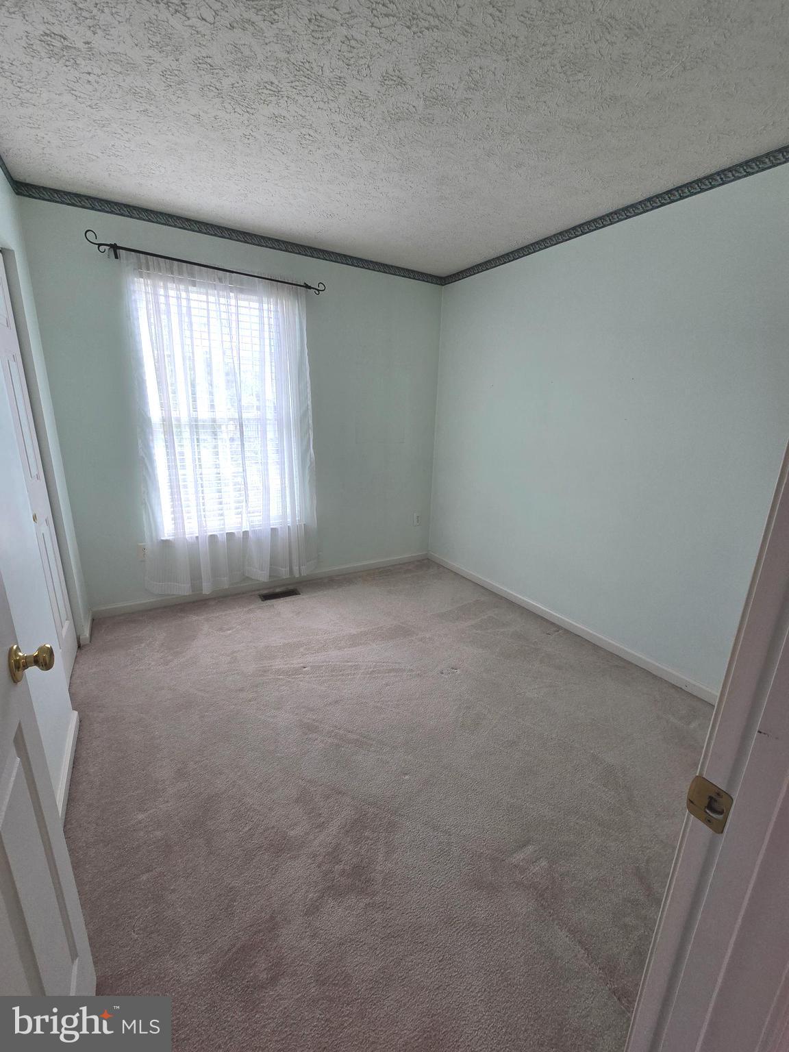 702 Jonathan Drive Joppa, MD 21085 - Photo 10 of 34 an empty room with a window