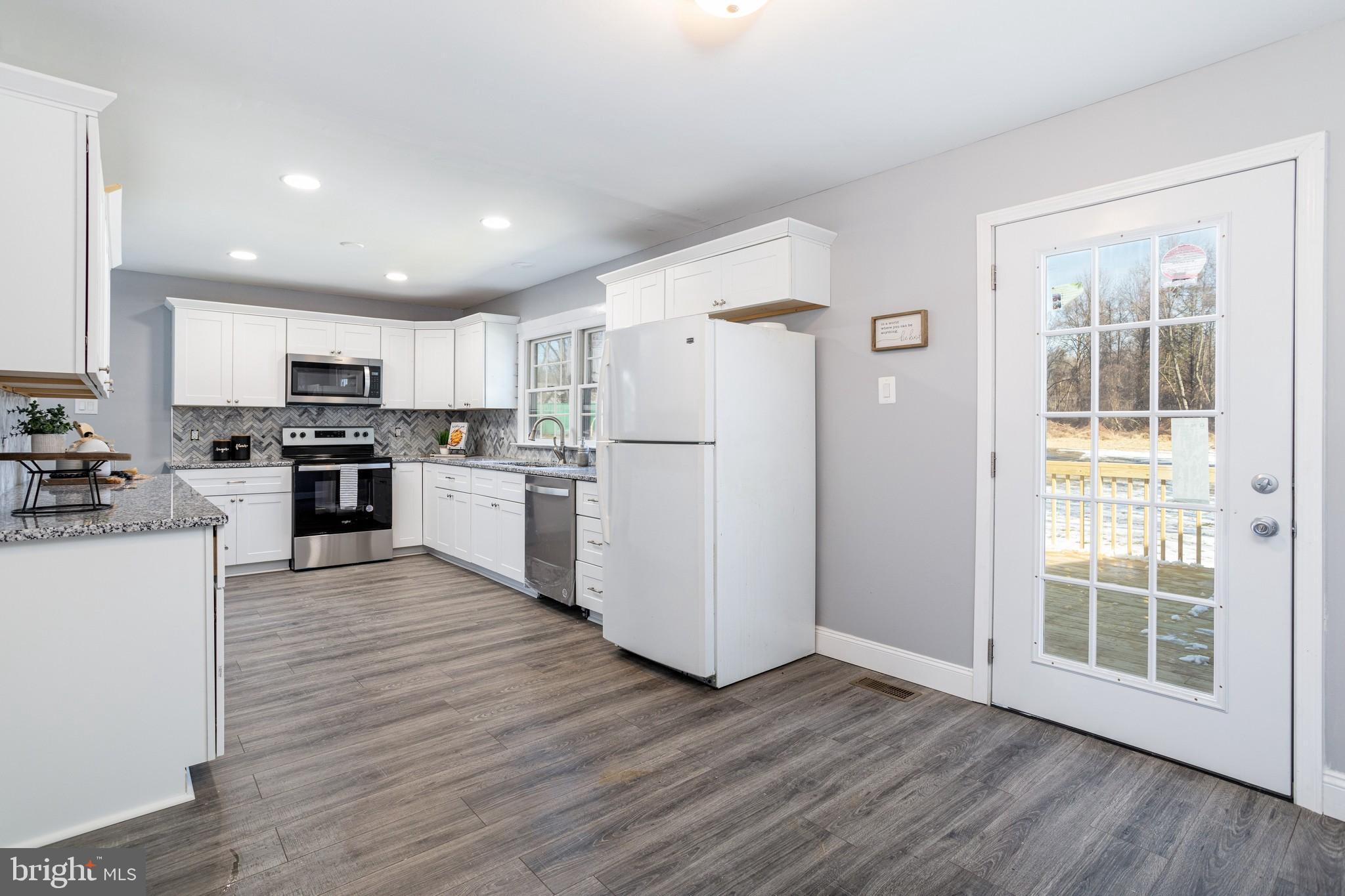 184 Burlin Road Port Deposit, MD 21904 - Photo 4 of 18 Eat in kitchen leading to deck