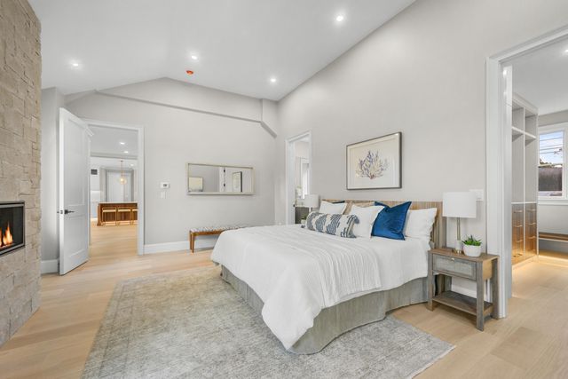 a bathroom with a shower sink vanity and mirror