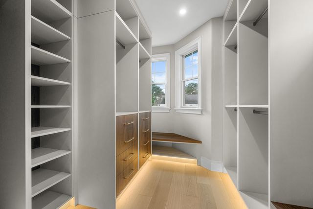 a bedroom with a large bed and a flat screen tv