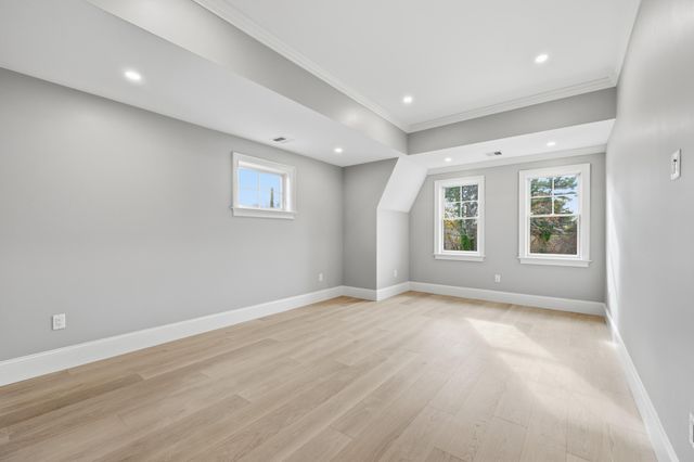 a view of balcony with wooden floor and fence