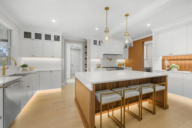 a kitchen with a refrigerator and a sink