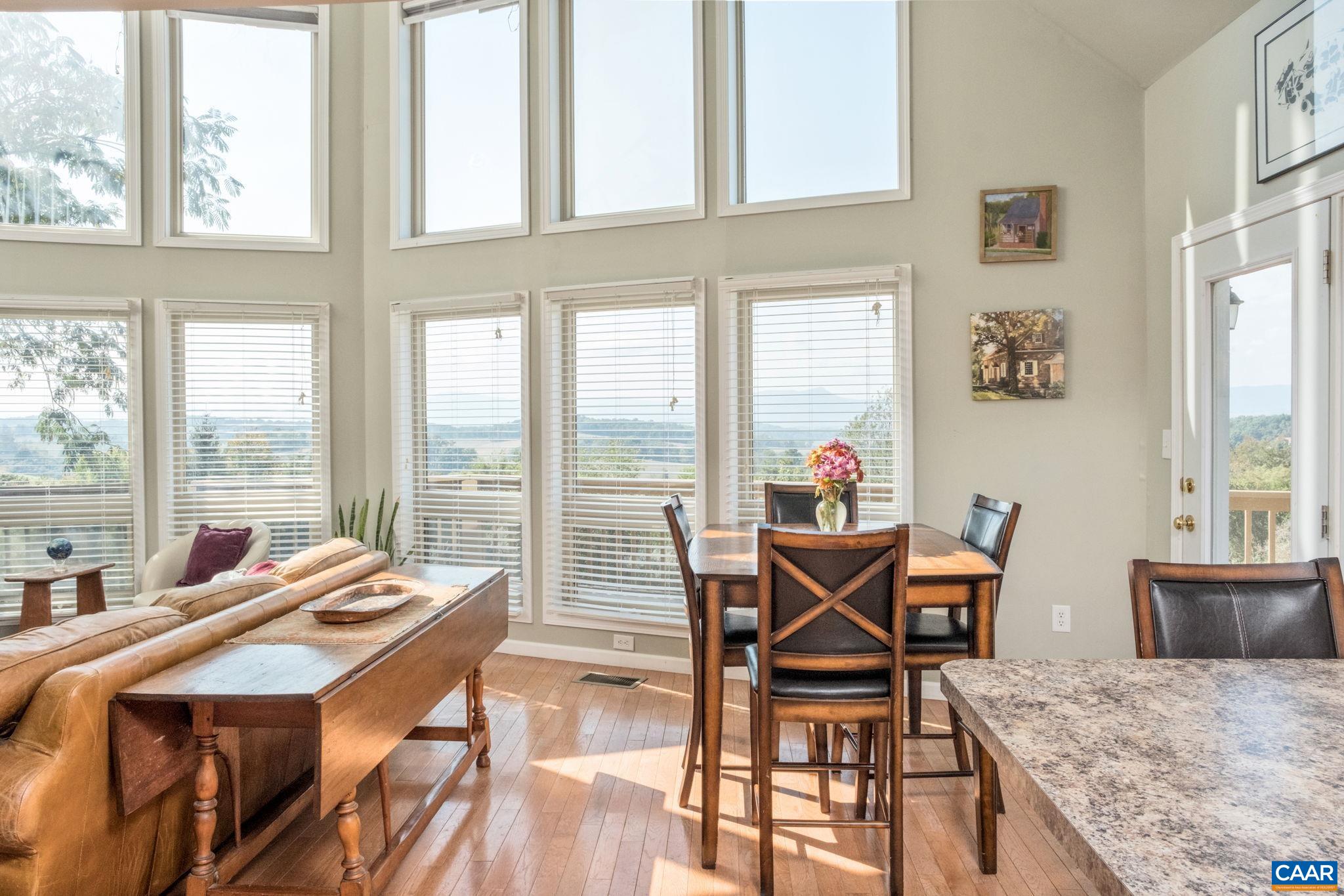 70 Percy Lane Fairfield, VA 24435 - Photo 52 of 52 a view of a dining room with furniture large windows and wooden floor