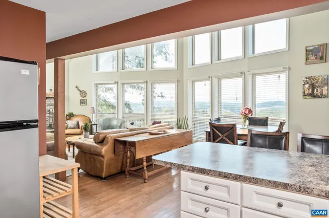 a kitchen with microwave a stove and furniture