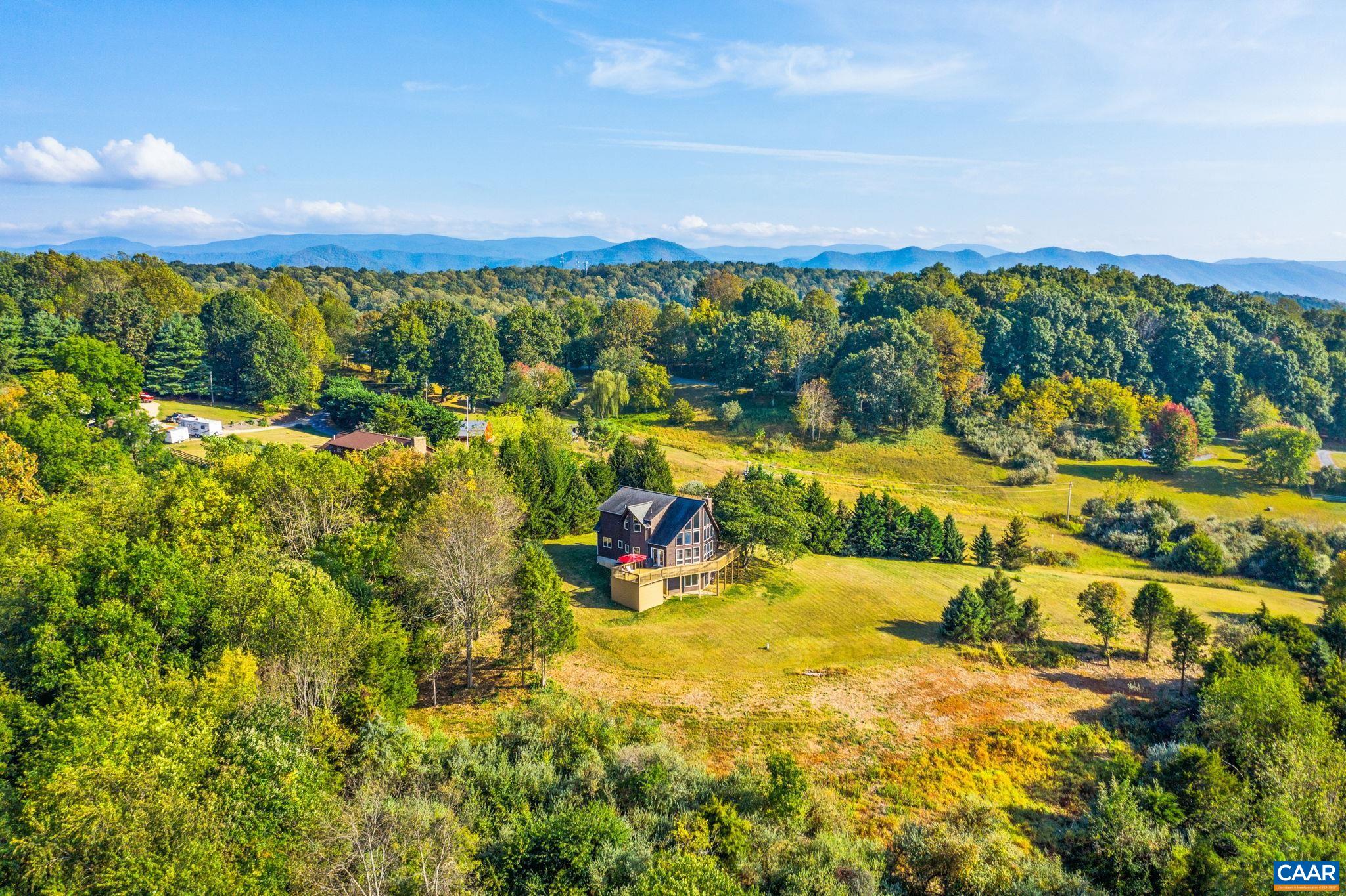 70 Percy Lane Fairfield, VA 24435 - Photo 2 of 52 a view of a lake with houses in the back