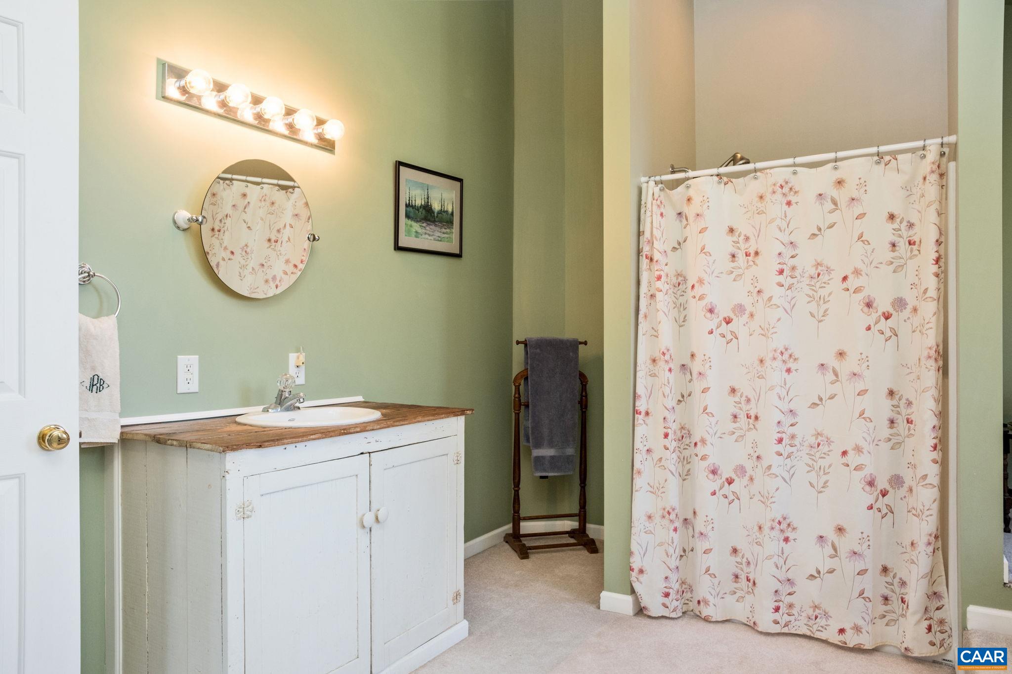 70 Percy Lane Fairfield, VA 24435 - Photo 28 of 52 a bathroom with a sink and a mirror
