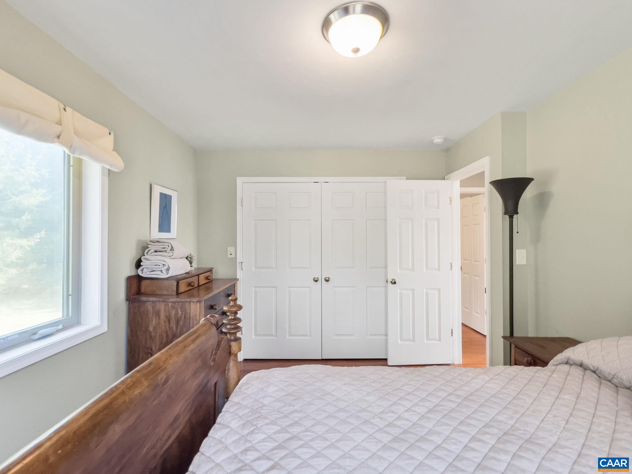 70 Percy Lane Fairfield, VA 24435 - Photo 32 of 52 a bedroom with a bed and wooden floor