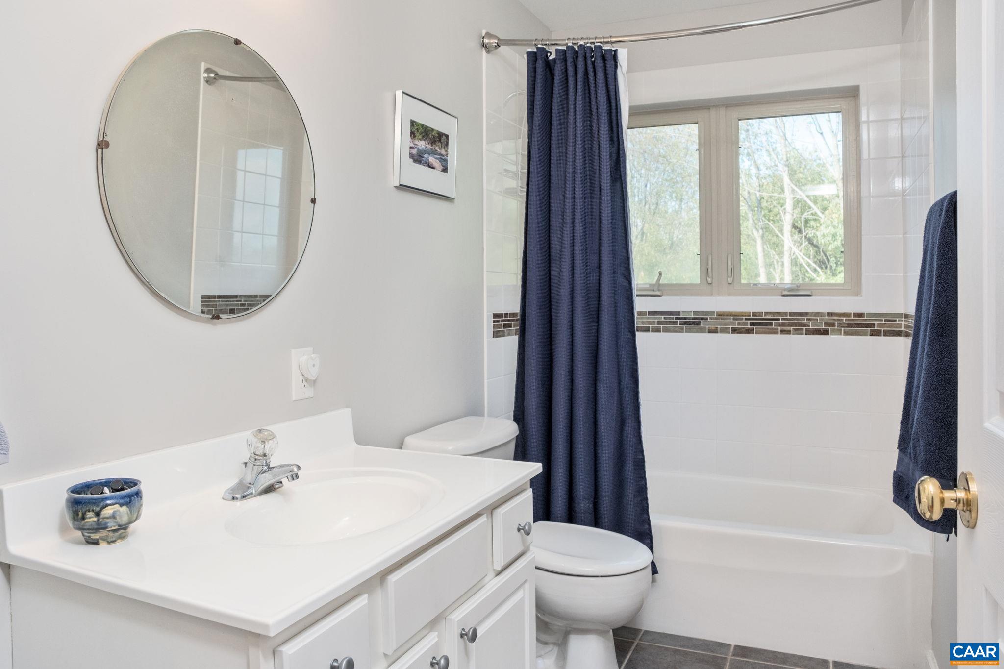 70 Percy Lane Fairfield, VA 24435 - Photo 35 of 52 a bathroom with a sink a toilet and a mirror