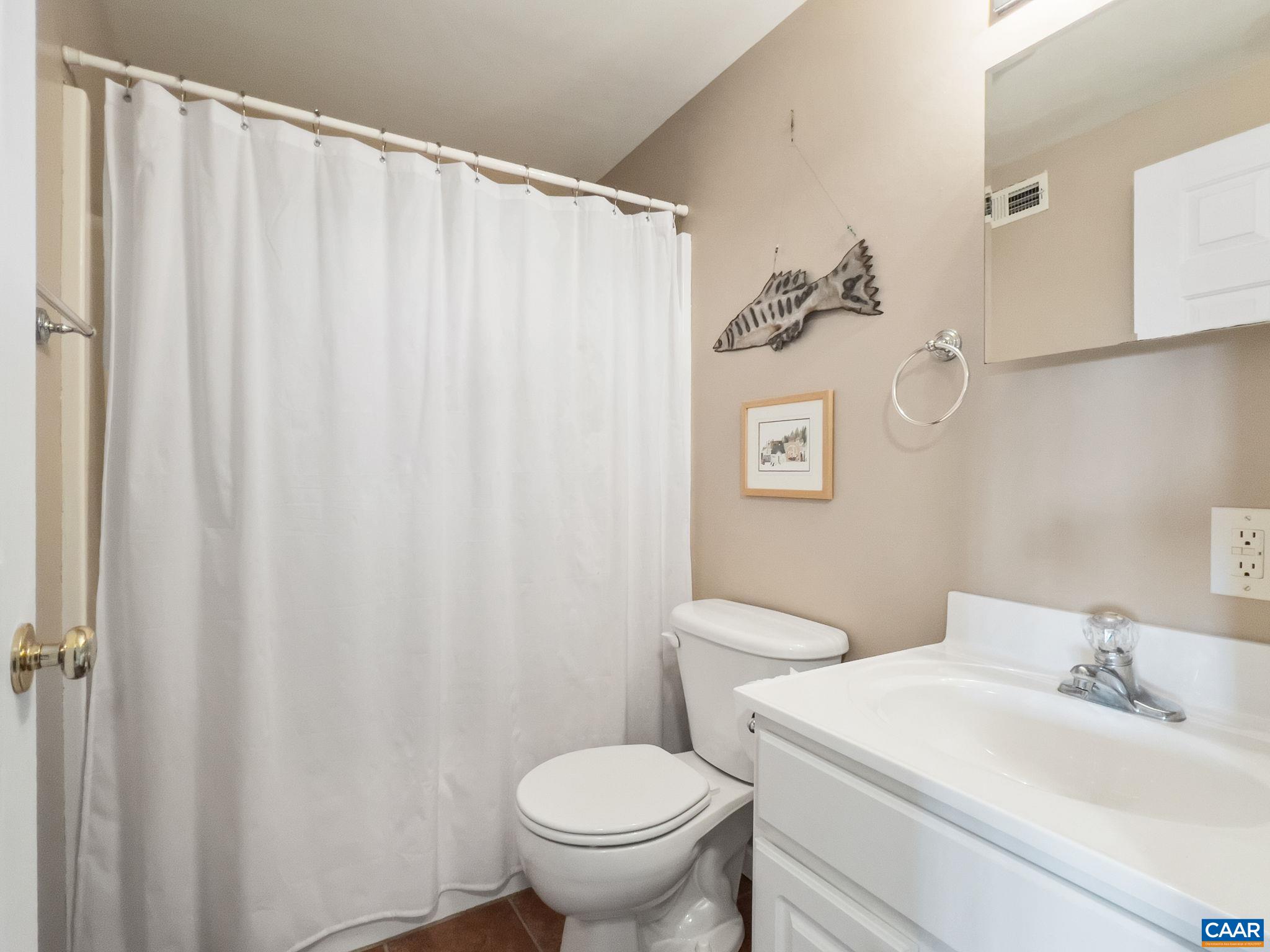 70 Percy Lane Fairfield, VA 24435 - Photo 44 of 52 a white toilet sitting next to a bathroom sink
