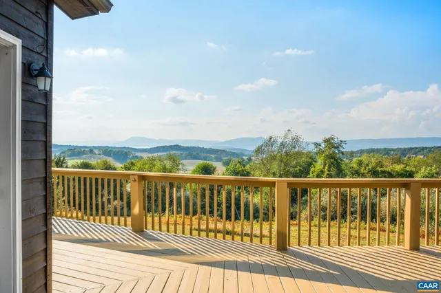 a view of a balcony with wooden floor