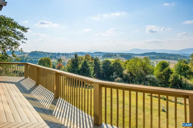 a view of a balcony with wooden floor