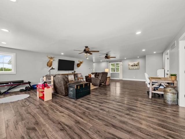 8294 North Leaf River Road Leaf River, IL 61047 - Photo 26 of 56 a living room with furniture and a flat screen tv