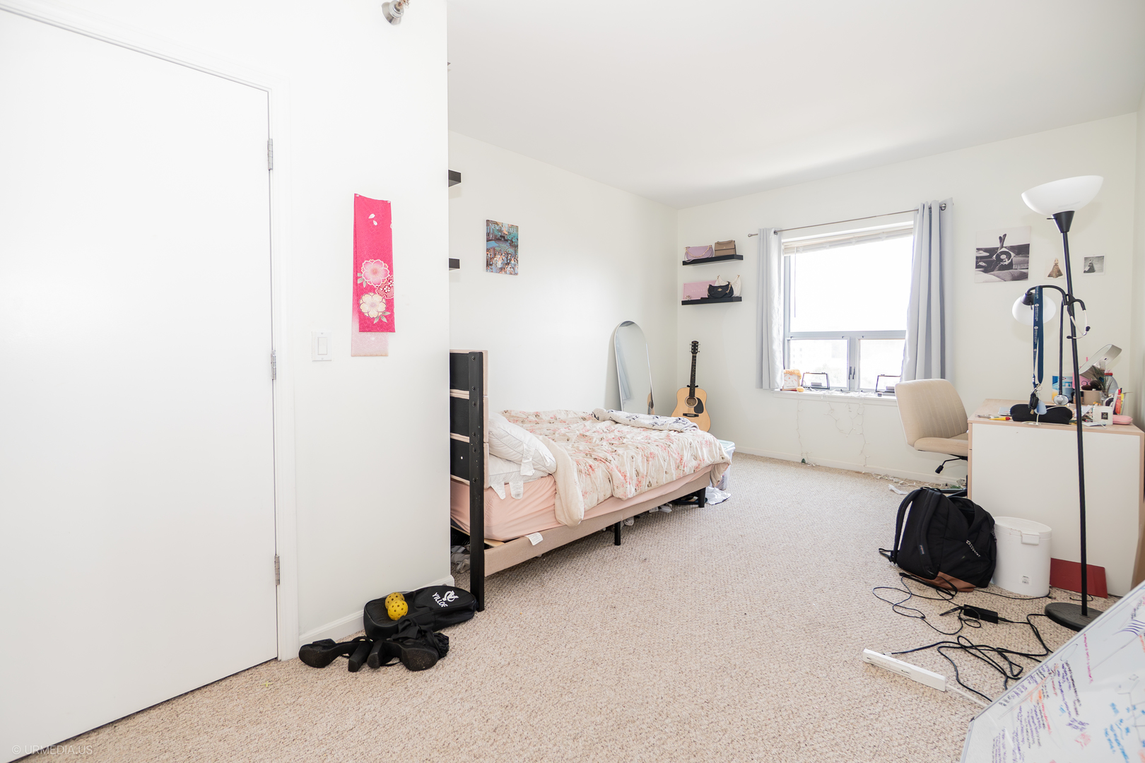 100 North Hermitage Avenue, Unit 716 Chicago, IL 60612 - Photo 11 of 25 a bedroom with a bed and a window