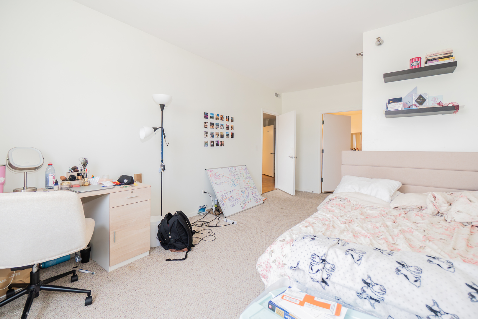 100 North Hermitage Avenue, Unit 716 Chicago, IL 60612 - Photo 12 of 25 a bedroom with a bed a desk and chair