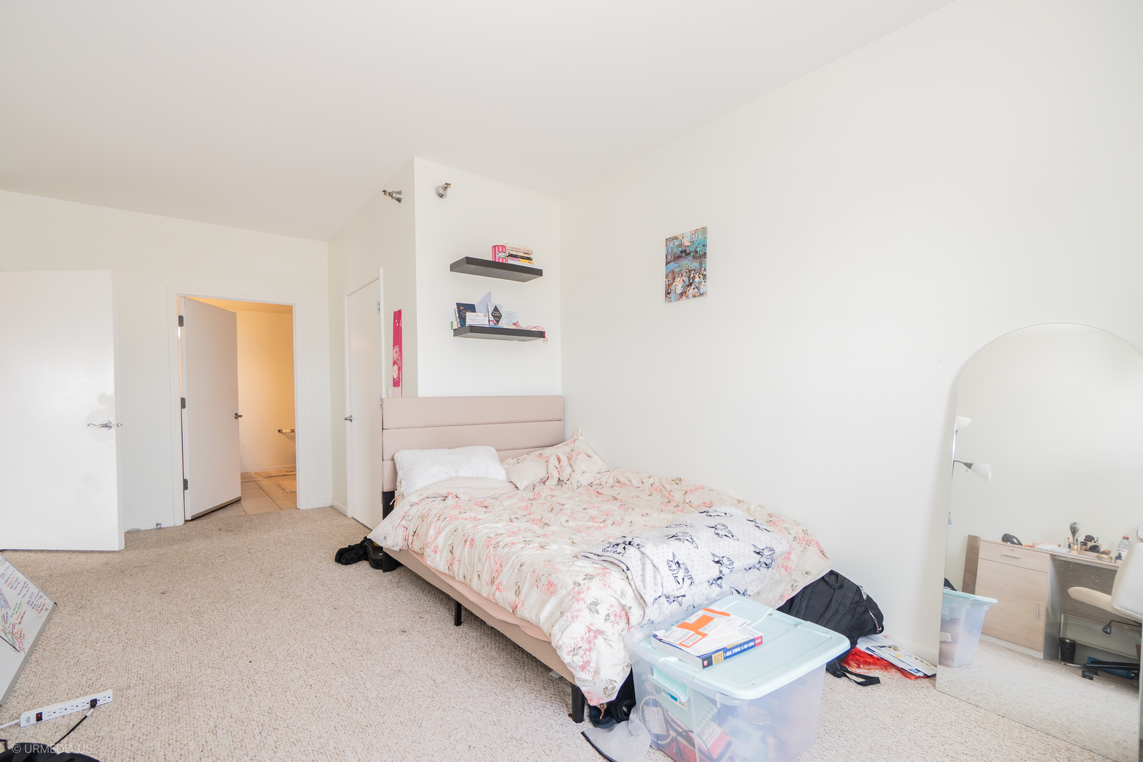 100 North Hermitage Avenue, Unit 716 Chicago, IL 60612 - Photo 13 of 25 a bedroom with a bed and a couch