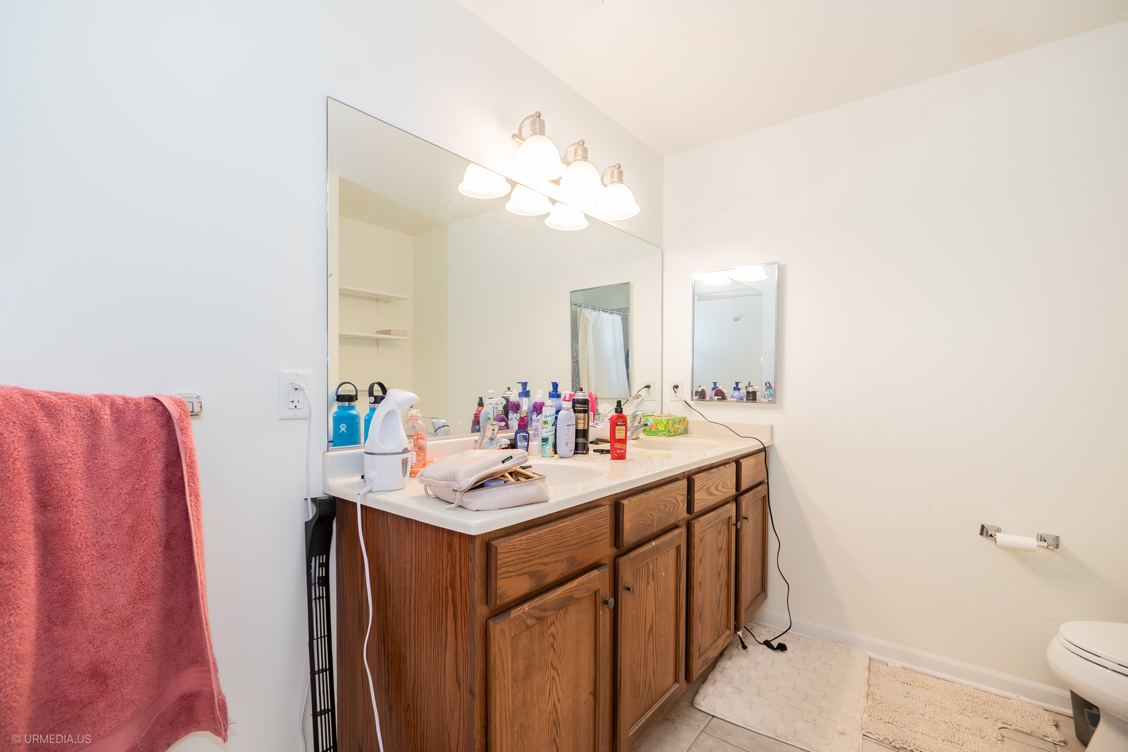 100 North Hermitage Avenue, Unit 716 Chicago, IL 60612 - Photo 16 of 25 a bathroom with a sink vanity mirror and toilet