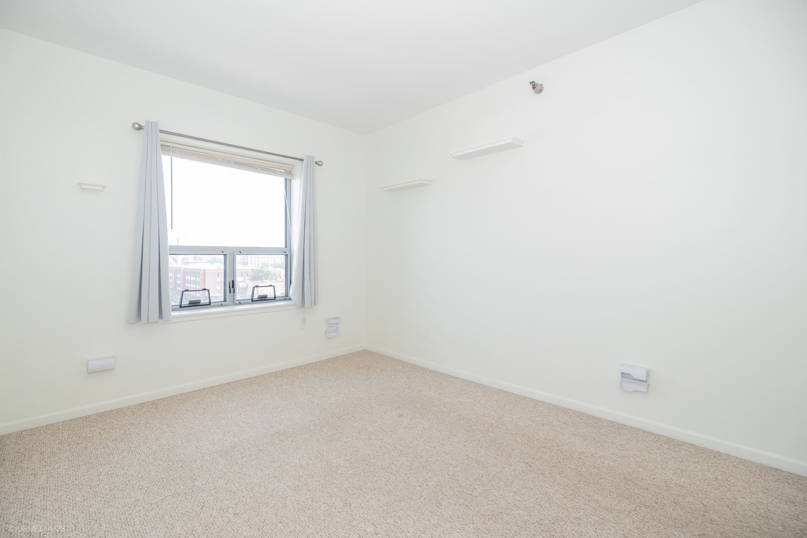 100 North Hermitage Avenue, Unit 716 Chicago, IL 60612 - Photo 19 of 25 an empty room with a window