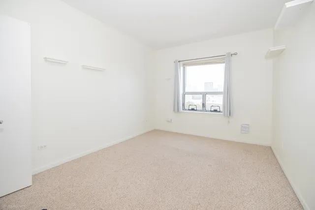 a view of a bathroom from a hallway