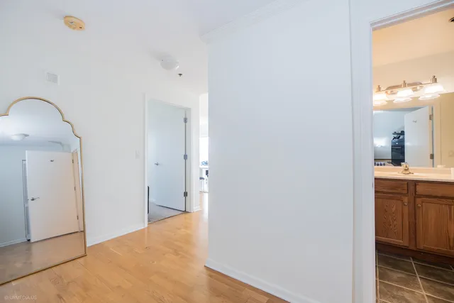 a living room with furniture and painting on the wall
