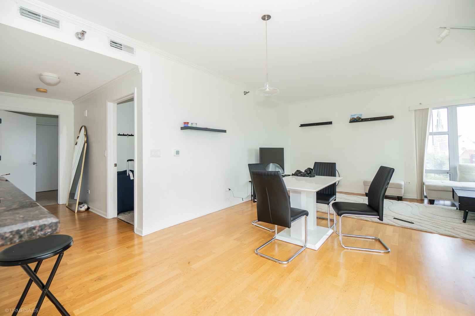 100 North Hermitage Avenue, Unit 716 Chicago, IL 60612 - Photo 7 of 25 a view of a dining room with furniture
