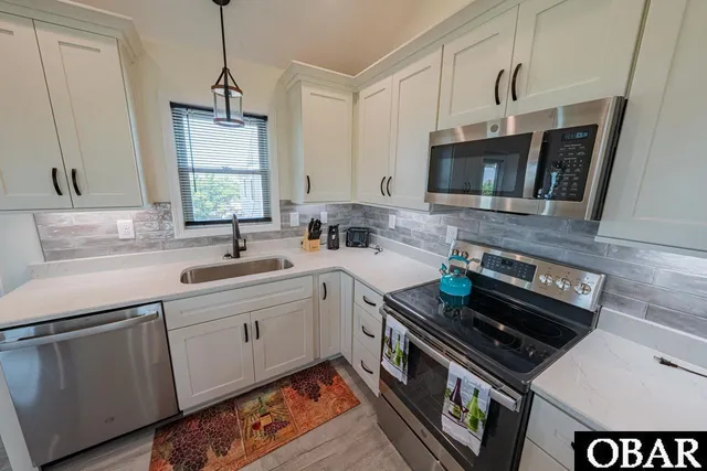 $899,000 | 40228 East Sunfish Court, Avon, NC 27915