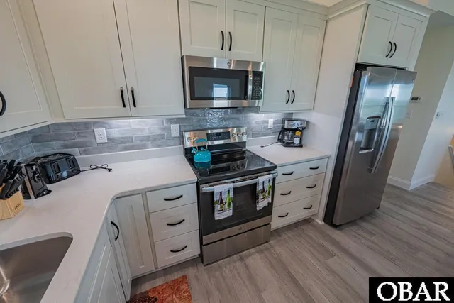 $899,000 | 40228 East Sunfish Court, Avon, NC 27915