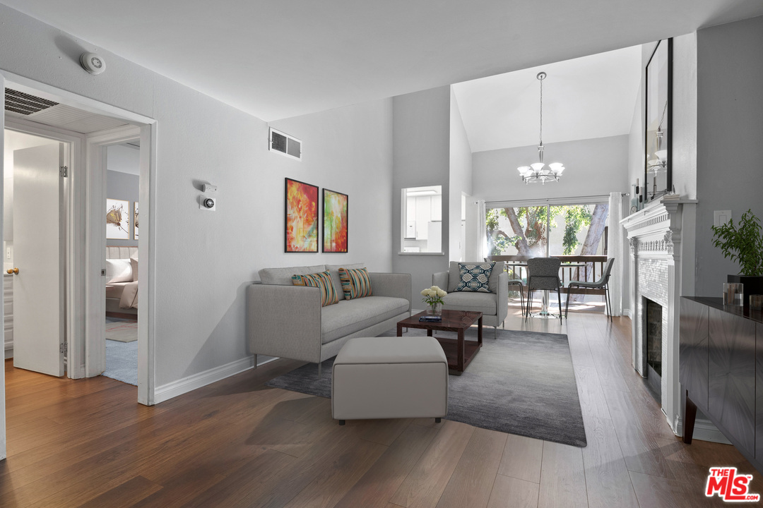 9302 Summertime Lane Culver City, CA 90230 - Photo 2 of 26 a living room with furniture wooden floor and a large window
