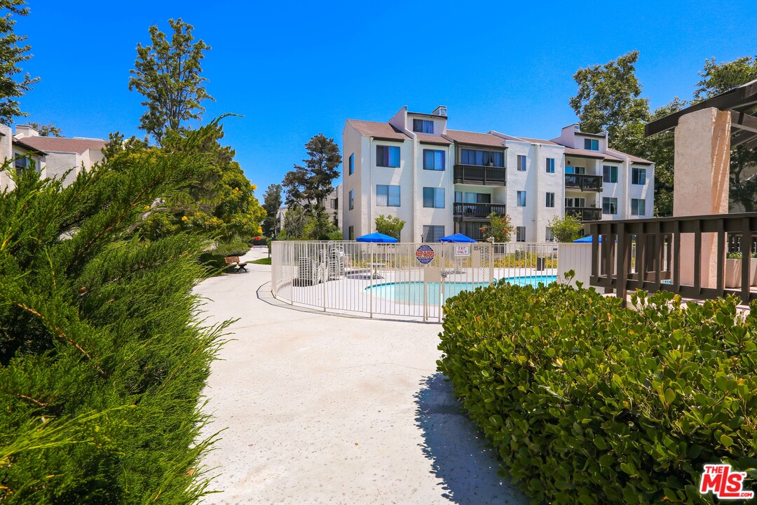 9302 Summertime Lane Culver City, CA 90230 - Photo 19 of 26 a view of a building with a yard and sitting area