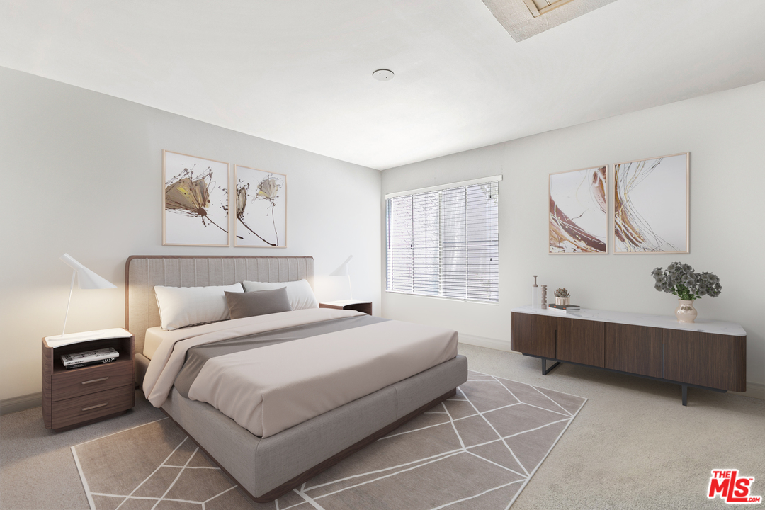 9302 Summertime Lane Culver City, CA 90230 - Photo 3 of 26 a spacious bedroom with a bed and a couch
