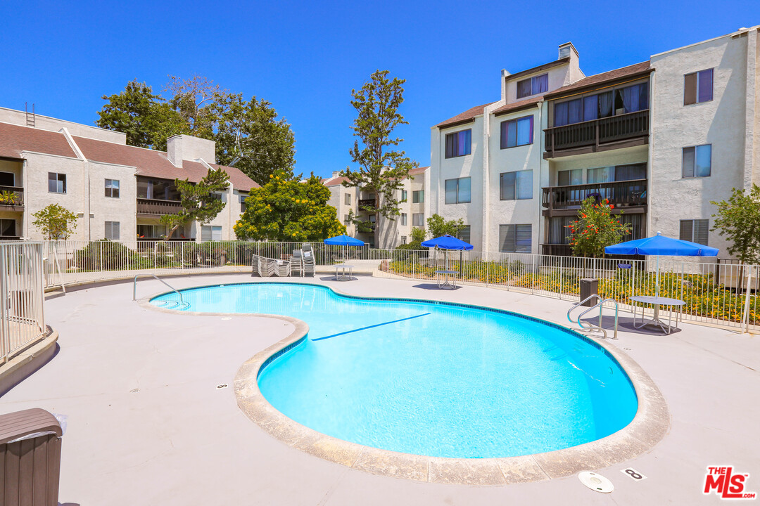 9302 Summertime Lane Culver City, CA 90230 - Photo 21 of 26 a view of a swimming pool with outdoor seating