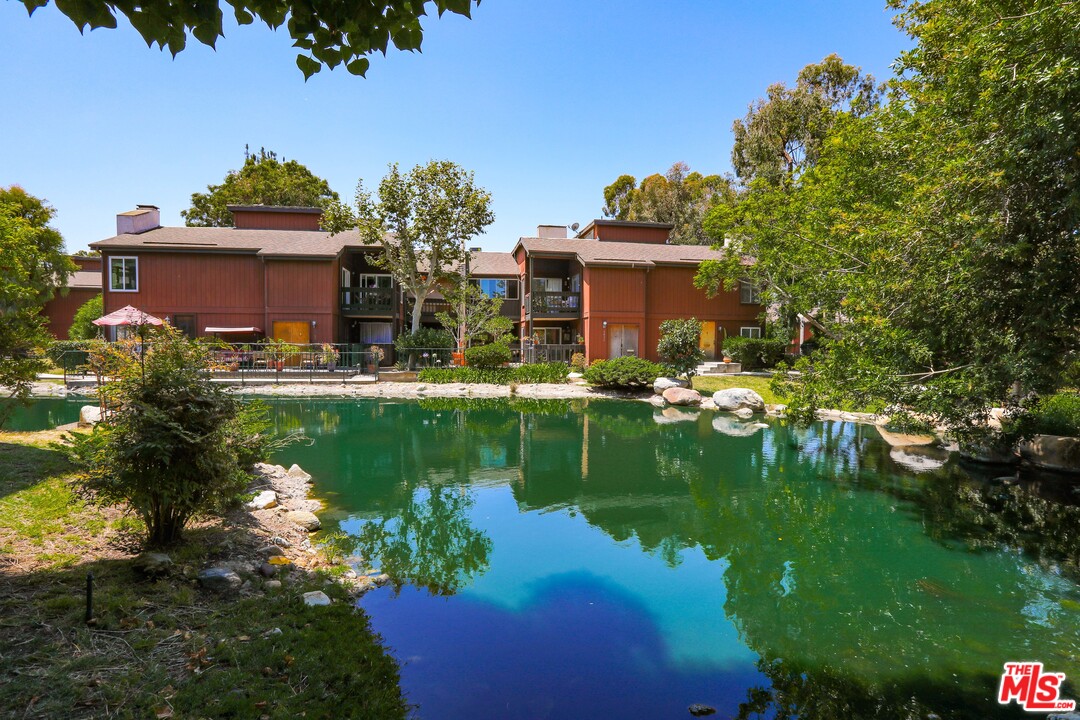9302 Summertime Lane Culver City, CA 90230 - Photo 24 of 26 a view of a house with a yard and a pond