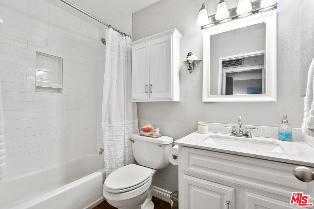 9302 Summertime Lane Culver City, CA 90230 - Photo 8 of 26 a bathroom with a sink a toilet and shower