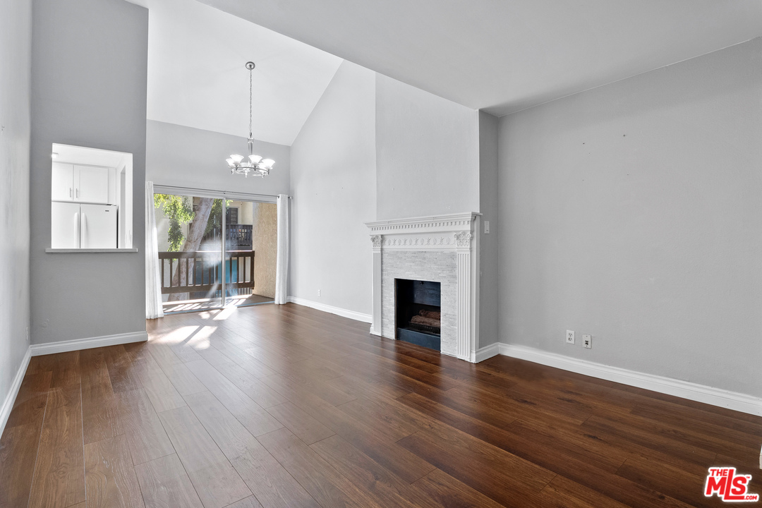 9302 Summertime Lane Culver City, CA 90230 - Photo 10 of 26 a view of an empty room with wooden floor and a window