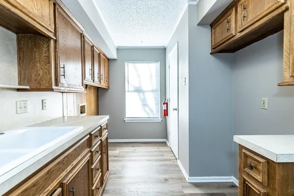 a kitchen with stainless steel appliances granite countertop a sink and a stove
