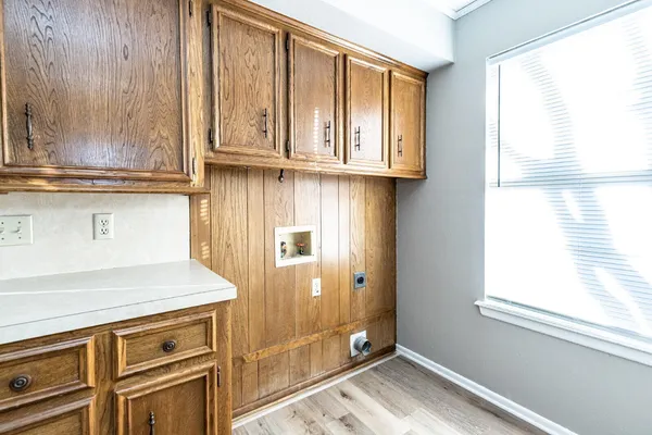 a kitchen with stainless steel appliances granite countertop a sink a stove and cabinets