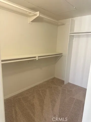 a view of an empty walk in closet