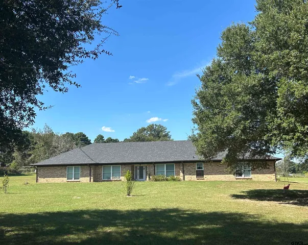 a view of a swimming pool with an outdoor space and seating area