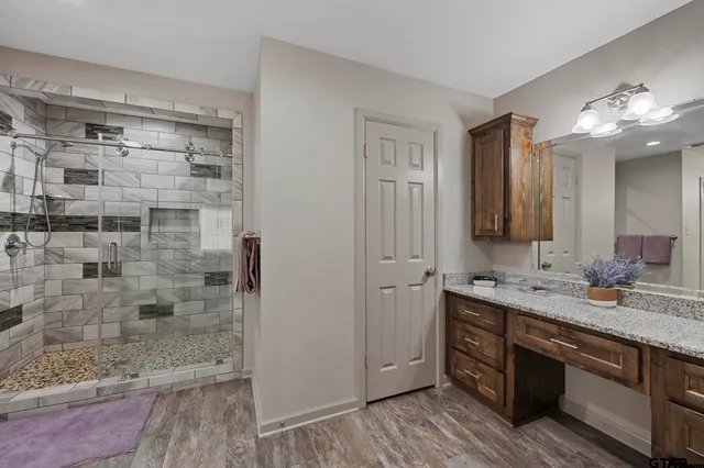 a bathroom with a double vanity sink and a mirror