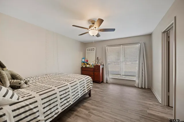 a bedroom with a bed and a closet