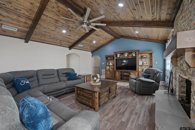 a living room with furniture and a fireplace
