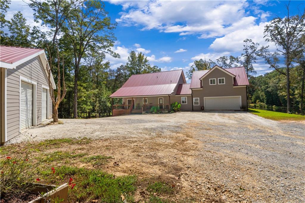 661 Wildcat Road Buchanan, GA 30113 - Photo 12 of 51 a front view of a house with a yard and garage