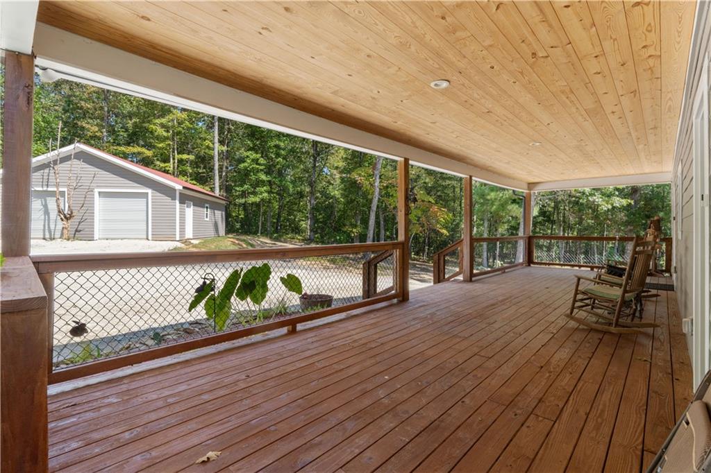 661 Wildcat Road Buchanan, GA 30113 - Photo 13 of 51 a view of a deck with wooden floor and furniture