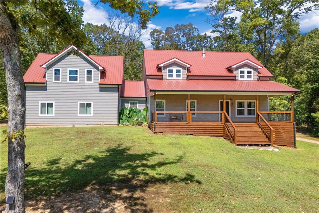661 Wildcat Road Buchanan, GA 30113 - Photo 2 of 51 a view of a house with a yard