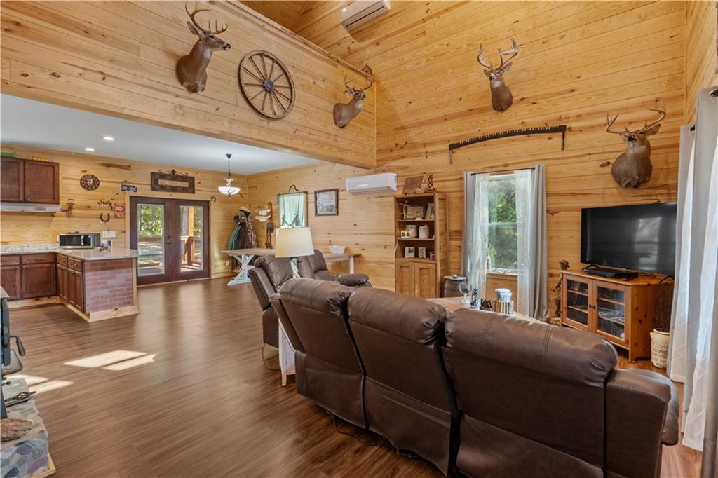 661 Wildcat Road Buchanan, GA 30113 - Photo 21 of 51 a living room with furniture and a flat screen tv