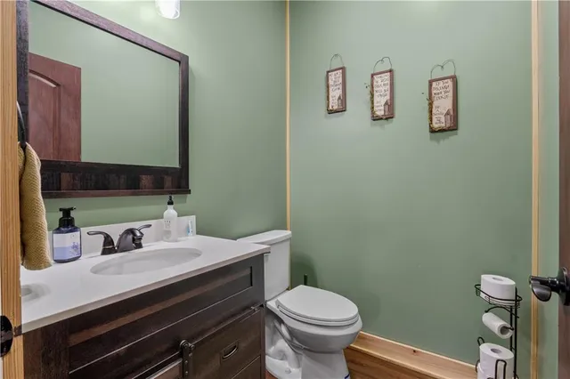 a living room with a dresser and a window