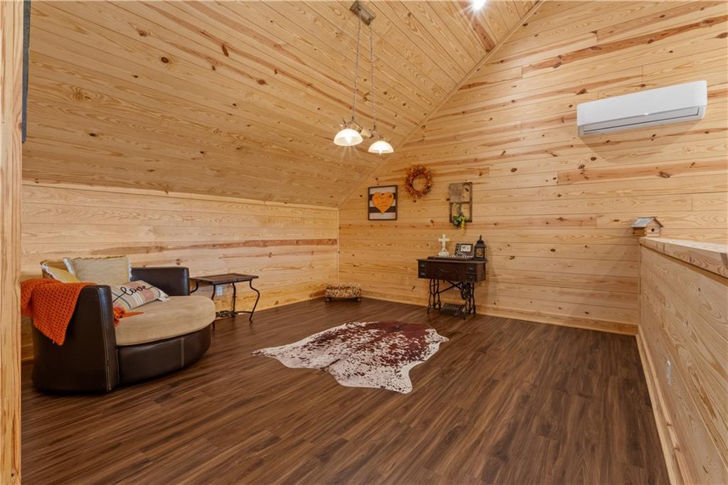 661 Wildcat Road Buchanan, GA 30113 - Photo 34 of 51 a living room with couch and a wooden floor