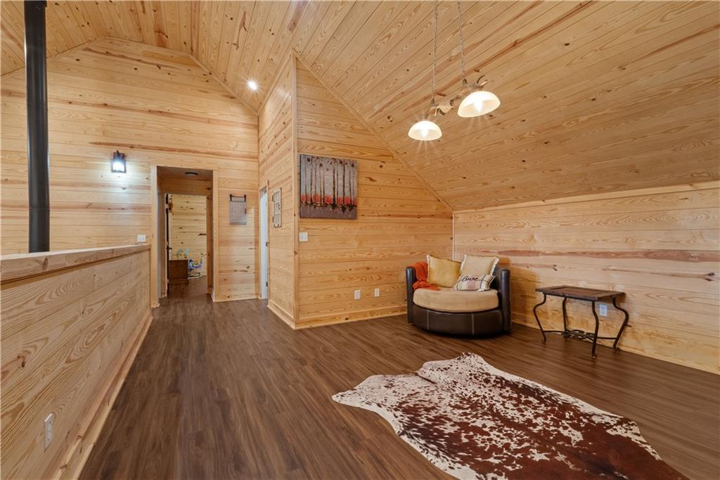 661 Wildcat Road Buchanan, GA 30113 - Photo 35 of 51 a living room with furniture and a wooden floor