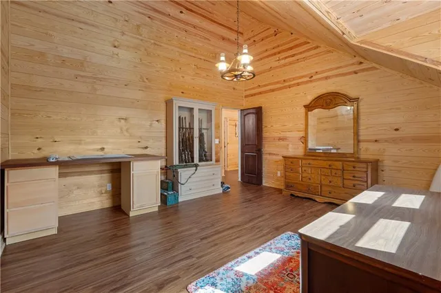a view of a livingroom with furniture and wooden floor
