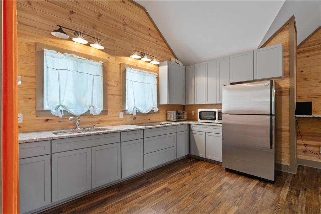 661 Wildcat Road Buchanan, GA 30113 - Photo 45 of 51 a kitchen with a refrigerator sink and cabinets